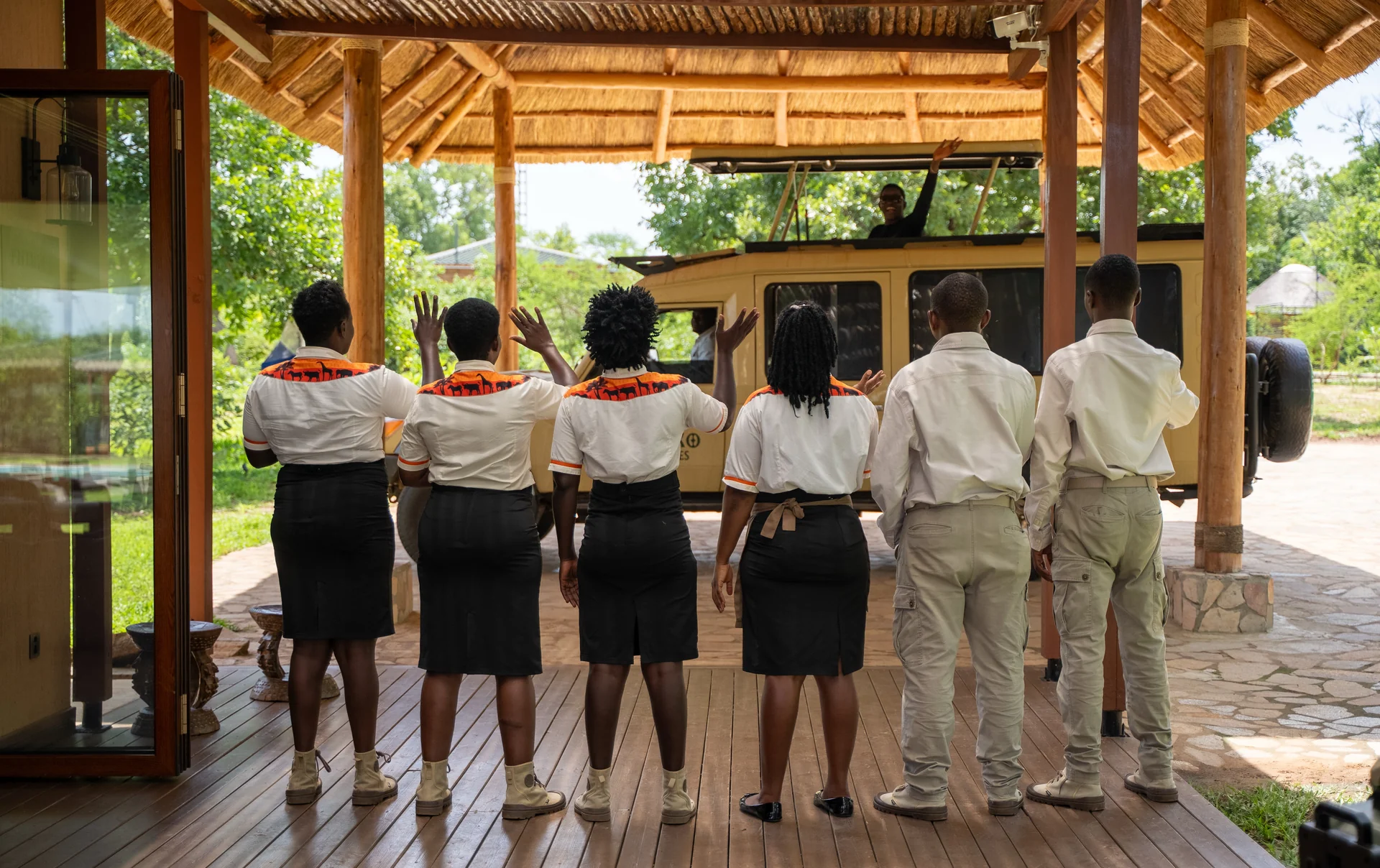 The Jackal Adventures team welcoming guests to a safari lodge