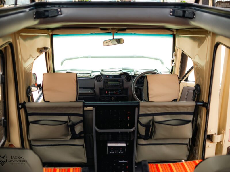 Dashboard, two-way radio and maps in a safari Land Cruiser
